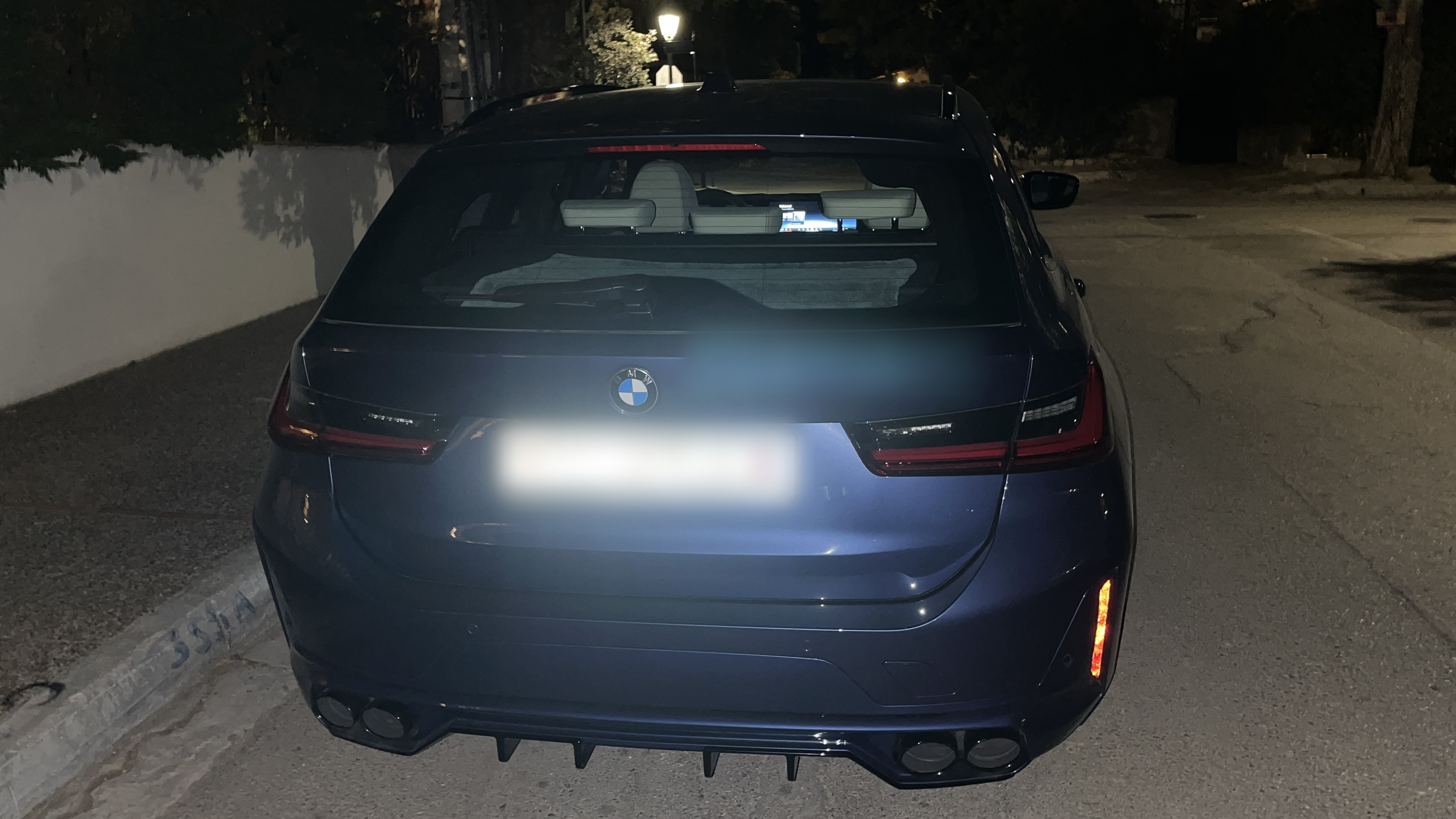 Rear view of the ALPINA B3 GT at night.